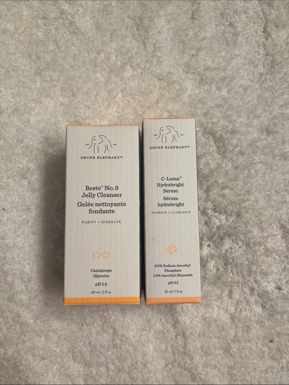 Drunk Elephant White and Orange Skincare.  Cleanser and serum Never tested!